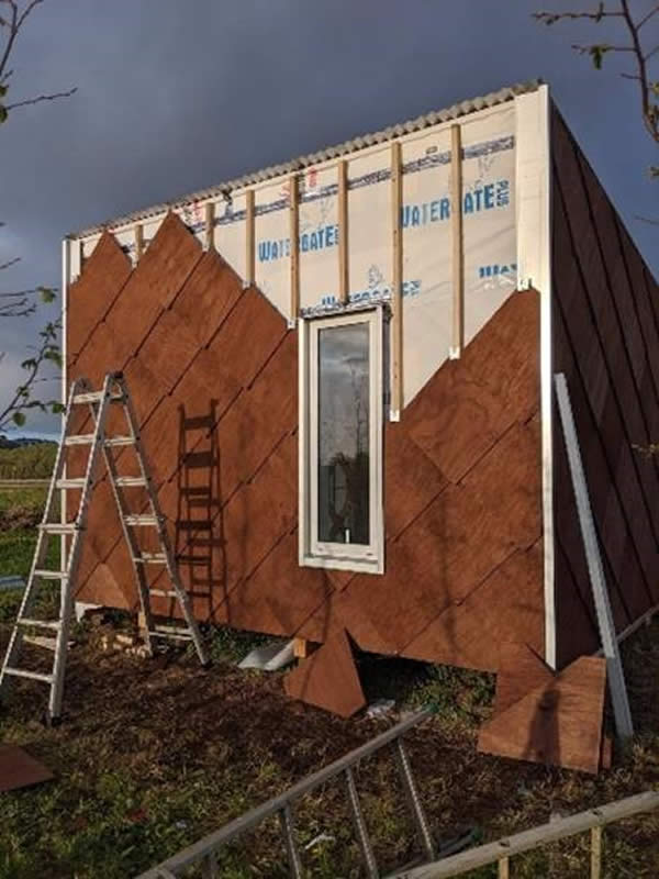 X-Frame Prototype Pod 1 with reusable shingle cladding and roof slope